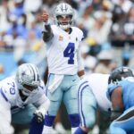 Dallas Cowboys quarterback Dak Prescott (4) communicates before the start of a play against the Carolina Panthers in the second quarter at Bank of America Stadium before the playoffs.