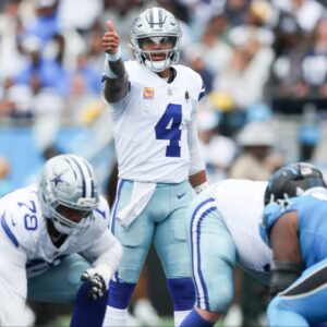Dallas Cowboys quarterback Dak Prescott (4) communicates before the start of a play against the Carolina Panthers in the second quarter at Bank of America Stadium before the playoffs.