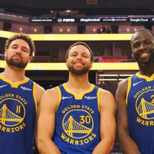 Golden State Warriors guard Klay Thompson (11), guard Stephen Curry (30) and forward Draymond Green (23) after the game against the Los Angeles Clippers at Chase Center.