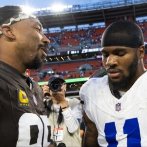 Cleveland Browns defensive end Myles Garrett (95) congratulates Dallas Cowboys linebacker Micah Parsons (11) after the game at Huntington Bank Field.