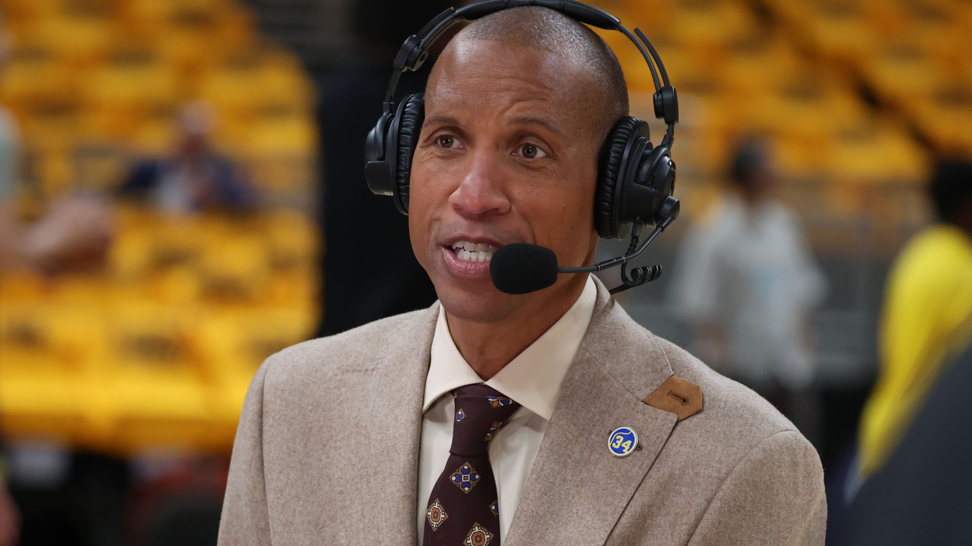 May 25, 2025; Indianapolis, Indiana, USA; Former Indiana Pacers guard Reggie Miller speaks on a broadcast prior to game three of the eastern conference finals for the 2025 NBA Playoffs at Gainbridge Fieldhouse