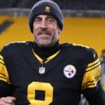 Pittsburgh Steelers quarterback Aaron Rodgers (8) runs off the field after the game against the Miami Dolphins at Acrisure Stadium.