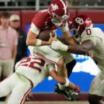 Nov 15, 2025; Tuscaloosa, Alabama, USA; Oklahoma Sooners defensive back Peyton Bowen (22) and defensive lineman David Stone (0) combine to tackle Alabama Crimson Tide quarterback Ty Simpson (15) at Saban Field at Bryant-Denny Stadium. Oklahoma defeated Alabama 23-21.