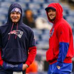 Buffalo Bills quarterback Josh Allen (17) and New England Patriots quarterback Drake Maye (10) talk on the field before the start of the game at Gillette Stadium