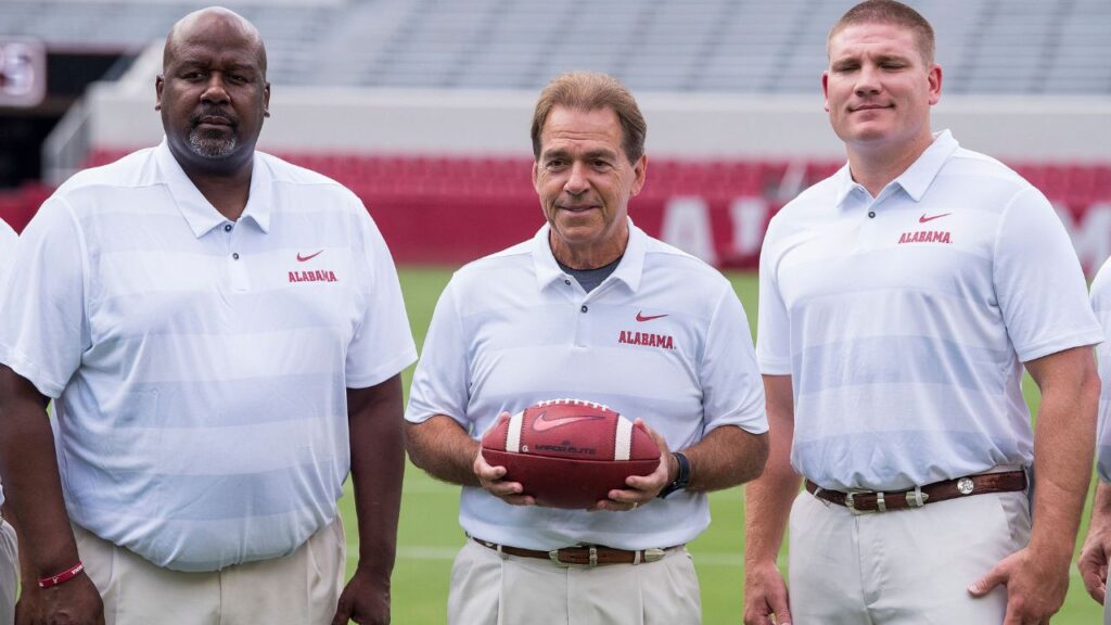 University of Alabama head coach Nick Saban poses with offensive coordinator Mike Locksley, left, and defensive coordinator Tosh Lupoi, right, on the Alabama campus in Tuscaloosa, Ala. on Saturday August 4, 2018. Media18