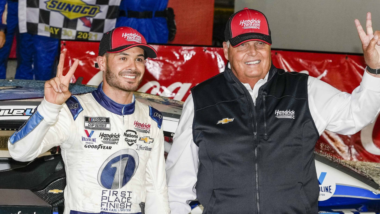 May 30, 2021; Concord, North Carolina, USA; NASCAR Cup Series driver Kyle Larson (5) celebrates his win with team owner Rick Hendrick at the Coca-Cola 600 at Charlotte Motor Speedway. Mandatory Credit: Jim Dedmon-Imagn Images