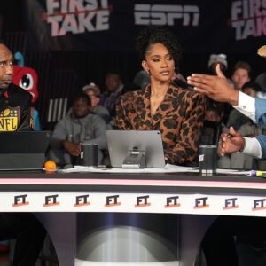 (Left to right) Stephen A. Smith, Amina Smith and Cam Newton discuss topics during ESPN's live broadcast of First Take at Memorial Hall at Delaware State University on October 29, 2025.