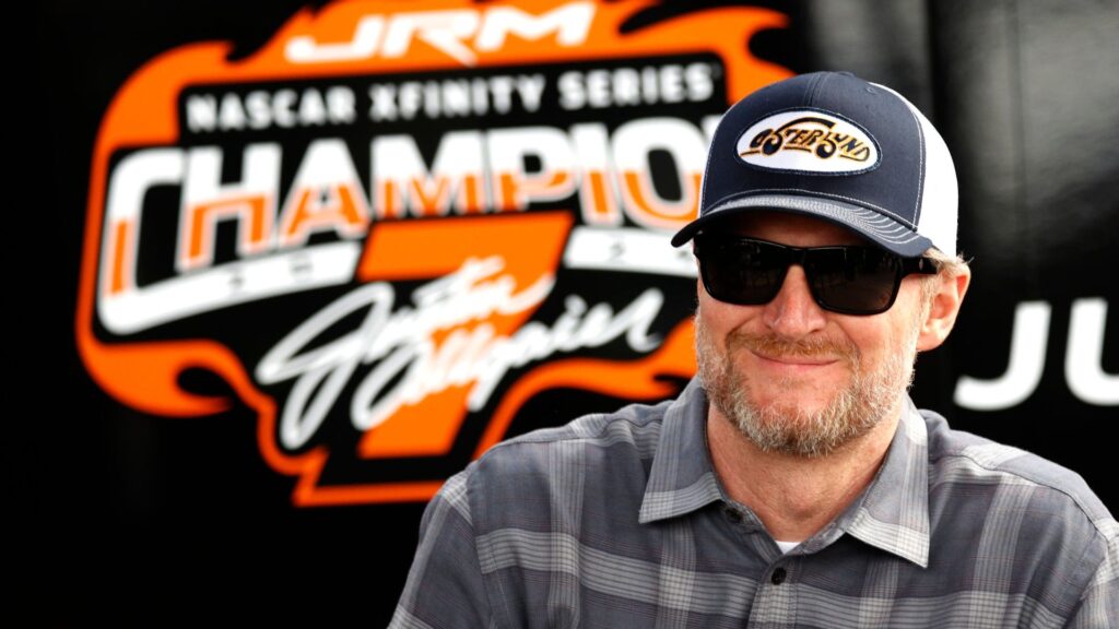 DAYTONA BEACH, FL - FEBRUARY 14: Dale Earnhardt Jr. watches the action from the garage prior to practice for the NASCAR, Motorsport, USA Xfinity Series United Rentals 300 on February 14, 2025 at Daytona International Speedway in Daytona Beach, FL