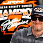 DAYTONA BEACH, FL - FEBRUARY 14: Dale Earnhardt Jr. watches the action from the garage prior to practice for the NASCAR, Motorsport, USA Xfinity Series United Rentals 300 on February 14, 2025 at Daytona International Speedway in Daytona Beach, FL