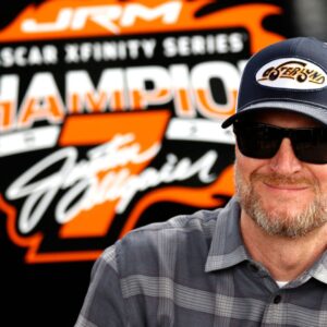 DAYTONA BEACH, FL - FEBRUARY 14: Dale Earnhardt Jr. watches the action from the garage prior to practice for the NASCAR, Motorsport, USA Xfinity Series United Rentals 300 on February 14, 2025 at Daytona International Speedway in Daytona Beach, FL