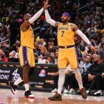 Mar 19, 2022; Washington, District of Columbia, USA; Los Angeles Lakers forward Carmelo Anthony (7) high fives forward LeBron James (6) during the second half against the Washington Wizards at Capital One Arena