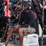 Apr 6, 2025; Darlington, South Carolina, USA; NASCAR Cup Series driver Tyler Reddick (45) team owner Michael Jordan watches his racer during the Goodyear 400 at Darlington Raceway.