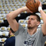 Dec 20, 2025; Denver, Colorado, USA; Denver Nuggets center Nikola Jokic (15) warms up before the game against the Houston Rockets at Ball Arena.