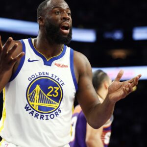 Dec 18, 2025; Phoenix, Arizona, USA; Golden State Warriors forward Draymond Green (23) reacts against the Phoenix Suns at Mortgage Matchup Center.
