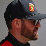 Feb 16, 2025; Daytona Beach, Florida, USA; NASCAR Cup Series driver Corey LaJoie (01) walks to the drivers meeting before the Daytona 500 at Daytona International Speedway.