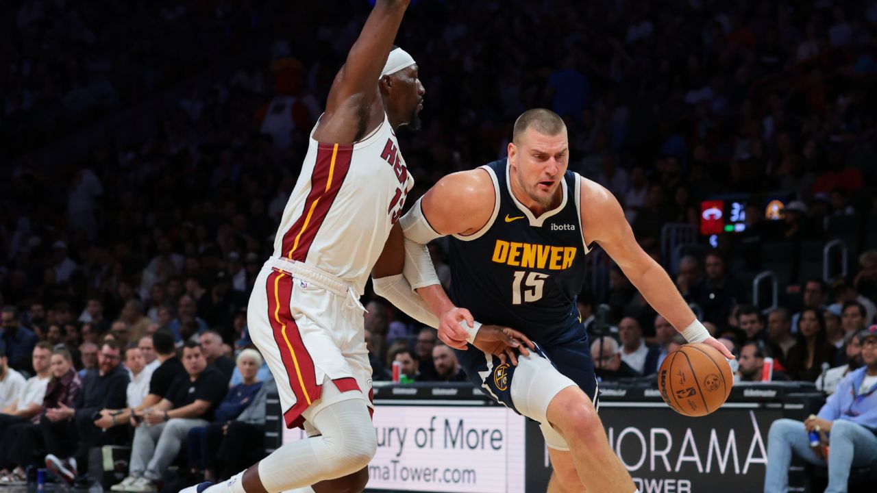 Denver Nuggets center Nikola Jokic (15) drives to the basket against Miami Heat center Bam Adebayo (13) during the second quarter at Kaseya Center.