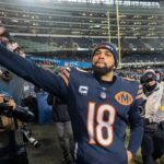 Chicago Bears quarterback Caleb Williams (18) high fives fans after defeating the Green Bay Packers during overtime at Soldier Field.