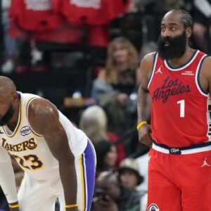 Los Angeles Lakers forward Lebron James (23) and LA Clippers guard James Harden (1) react in the first half at Intuit Dome.