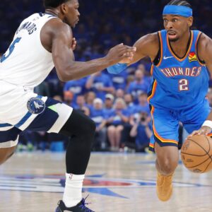 May 22, 2025; Oklahoma City, Oklahoma, USA; Oklahoma City Thunder guard Shai Gilgeous-Alexander (2) drives against Minnesota Timberwolves guard Anthony Edwards (5) in the first quarter during game two of the western conference finals for the 2025 NBA Playoffs at Paycom Center