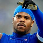 New York Giants linebacker Abdul Carter (51)l recognizes fans as he pauses during pregame practice, Thursday, August 21, 2025, in East Rutherford.