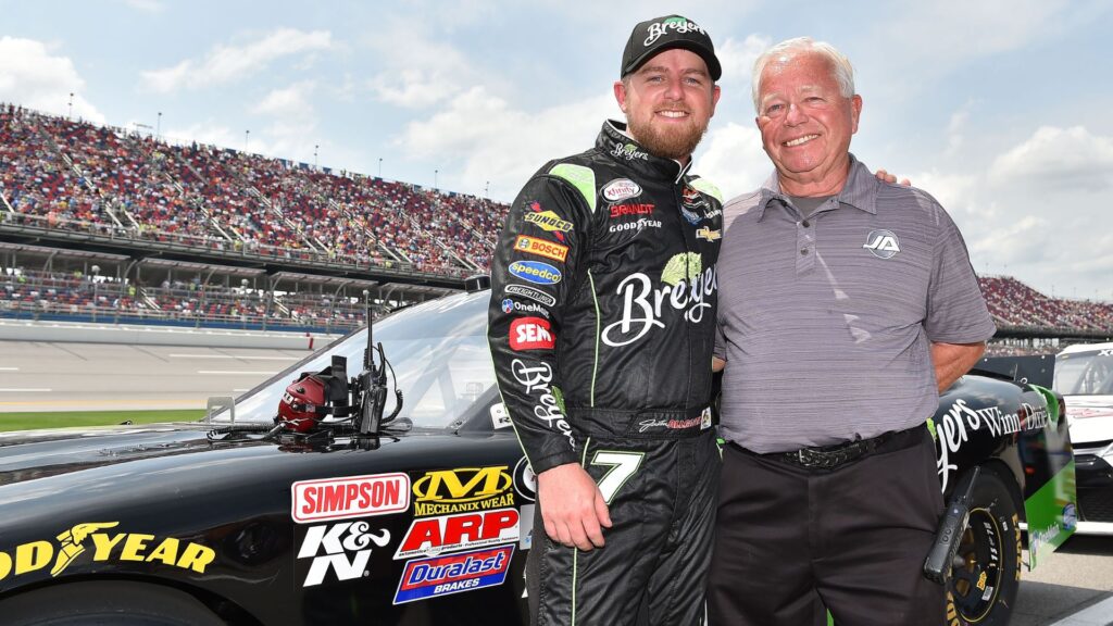Apr 30, 2016; Talladega, AL, USA; NASCAR Xfinity Series driver Justin Allgaier (left) and his father Mike Allgaier (right) pose for a photo before the Sparks Energy 300 at Talladega Superspeedway