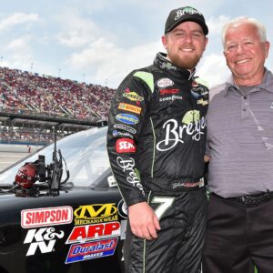 Apr 30, 2016; Talladega, AL, USA; NASCAR Xfinity Series driver Justin Allgaier (left) and his father Mike Allgaier (right) pose for a photo before the Sparks Energy 300 at Talladega Superspeedway