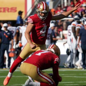 San Francisco 49ers kicker Jake Moody (4) kicks an extra point as punter Thomas Morstead (7) holds the ball in the first quarter against the Denver Broncos at Levi's Stadium