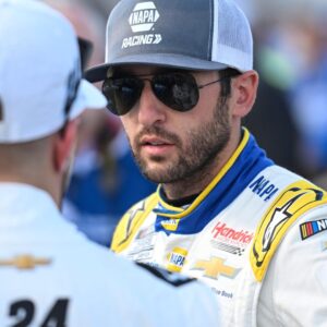 Sep 6, 2025; Madison, Illinois, USA; NASCAR Cup Series driver Chase Elliott (9) speaks with NASCAR Cup Series driver William Byron (24) during practice and qualifying for the Enjoy Illinois 300 at World Wide Technology Raceway.