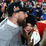 Recording artist Taylor Swift and Kansas City Chiefs tight end Travis Kelce (87) react after the AFC Championship game against the Buffalo Bills at GEHA Field at Arrowhead Stadium.