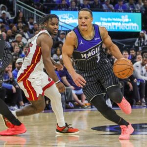 Orlando Magic guard Desmond Bane (3) drives to the basket around Miami Heat guard Davion Mitchell (45) during the second half at Kia Center.