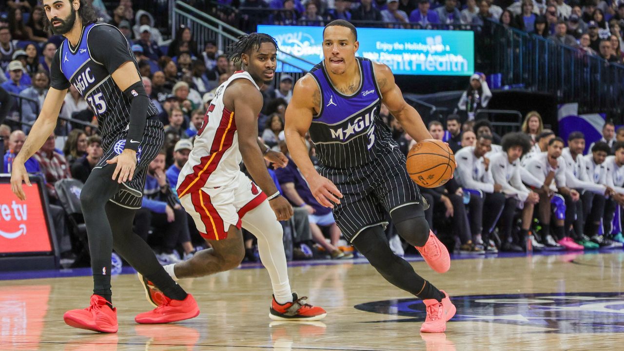 Orlando Magic guard Desmond Bane (3) drives to the basket around Miami Heat guard Davion Mitchell (45) during the second half at Kia Center.