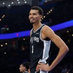 Dec 25, 2025; Oklahoma City, Oklahoma, USA; San Antonio Spurs forward Victor Wembanyama (1) smiles after a play against the Oklahoma City Thunder during the second half at Paycom Center.