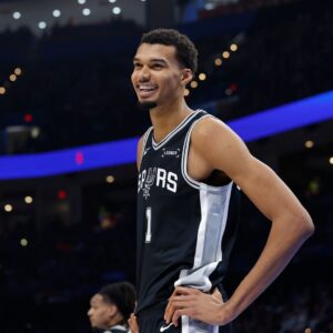 Dec 25, 2025; Oklahoma City, Oklahoma, USA; San Antonio Spurs forward Victor Wembanyama (1) smiles after a play against the Oklahoma City Thunder during the second half at Paycom Center.