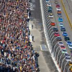 Feb 19, 2024; Daytona Beach, Florida, USA; NASCAR Cup Series driver Joey Logano (22) and Michael McDowell (34) lead the field to the green flag during the Daytona 500 at Daytona International Speedway.