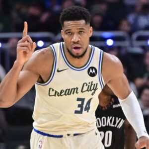 Milwaukee Bucks forward Giannis Antetokounmpo (34) reacts after scoring his 21,000th career point in the third quarter against the Brooklyn Nets at Fiserv Forum.