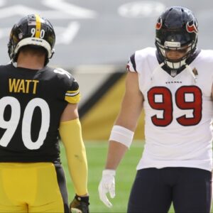 NFL referee Shawn Smith (14) flips the coin as brothers Pittsburgh Steelers outside linebacker T.J. Watt (90) and Houston Texans defensive end J.J. Watt (99) take part before their game against at Heinz Field. The Steelers won 28-21.