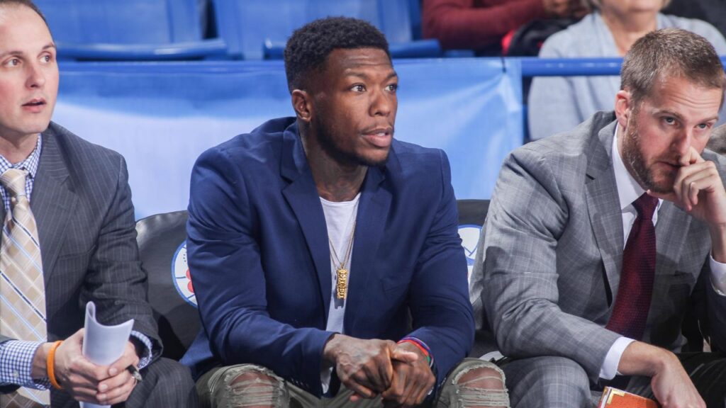Delaware 87ers Guard NATE ROBINSON watches a regular season game between the Delaware 87ers and the Canton Charge (Cleveland Cavaliers) in street clothes after signing with Delaware