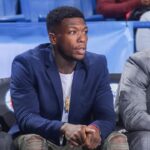Delaware 87ers Guard NATE ROBINSON watches a regular season game between the Delaware 87ers and the Canton Charge (Cleveland Cavaliers) in street clothes after signing with Delaware