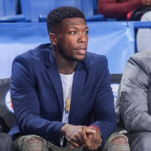 Delaware 87ers Guard NATE ROBINSON watches a regular season game between the Delaware 87ers and the Canton Charge (Cleveland Cavaliers) in street clothes after signing with Delaware