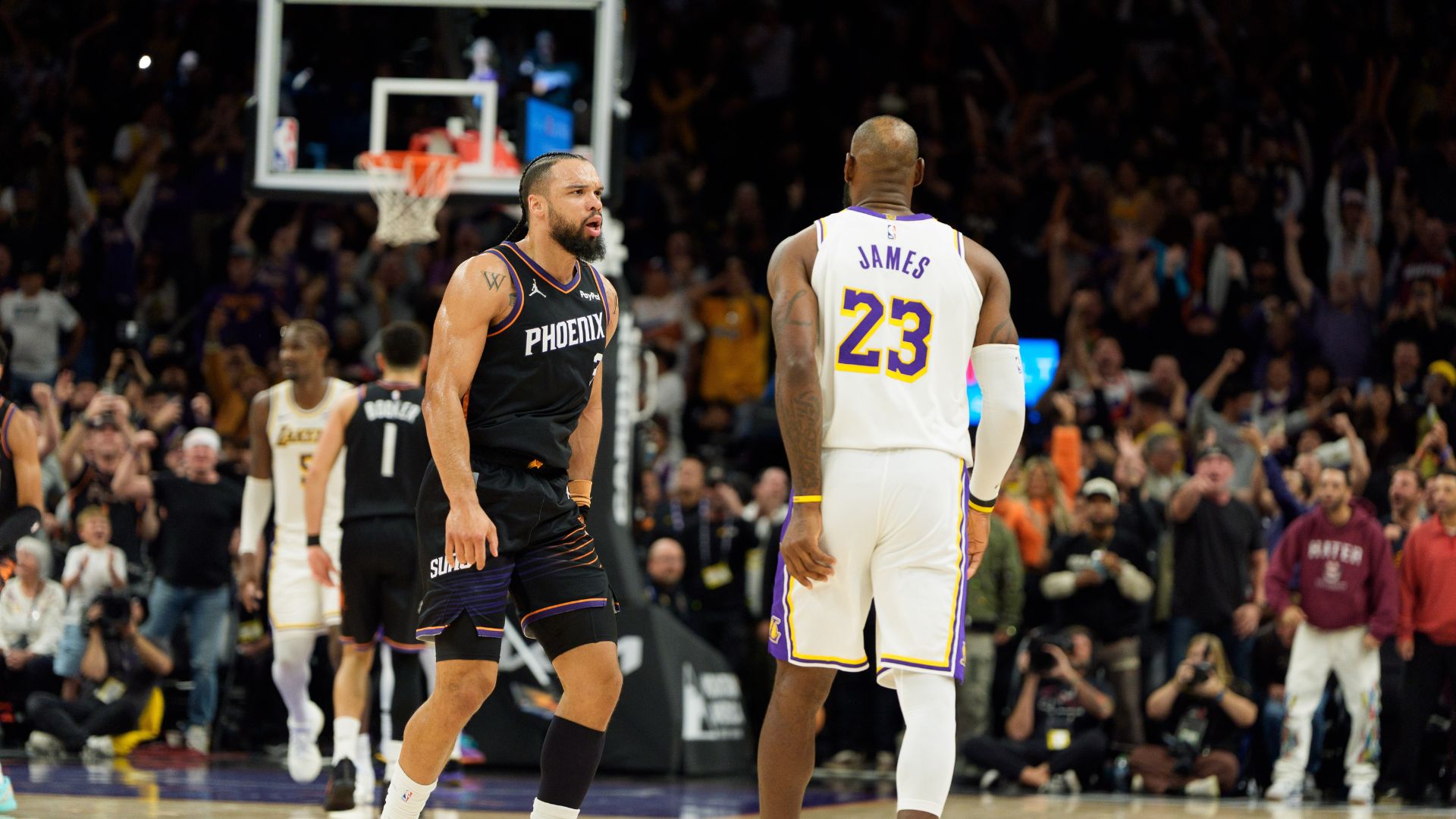 Dec 14, 2025; Phoenix, Arizona, USA; Phoenix Suns forward Dillon Brooks (3) and Los Angeles Lakers forward LeBron James (23) react during an altercation that resulted in a technical for Brooks during the second half of a game at at Mortgage Matchup Center.
