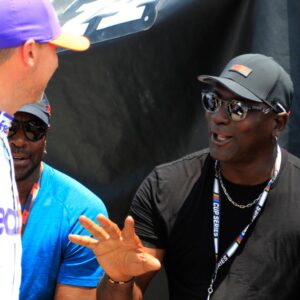 23Xi co-owner Michael Jordan talks with Denny Hamlin ( 11 Joe Gibbs Racing FedEx Ground Toyota) during qualifying for the NASCAR, Motorsport, USA Cup Series Ally 400 on June 24, 2023