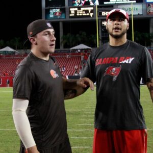 Cleveland Browns quarterback Johnny Manziel (2) and Tampa Bay Buccaneers wide receiver Mike Evans (13) talk after the game at Raymond James Stadium. Cleveland Browns defeated the Tampa Bay Buccaneers 31-7.