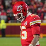Kansas City Chiefs quarterback Patrick Mahomes (15) lowers his head during the fourth quarter against the Houston Texans at GEHA Field at Arrowhead Stadium.