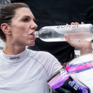 NASCAR Cup Series driver Katherine Legge (78) takes a sip of water Saturday, July 26, 2025, after her qualifying run for the Brickyard 400 at Indianapolis Motor Speedway.