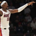 Dec 1, 2025; Miami, Florida, USA; Miami Heat center Bam Adebayo (13) celebrates a three-pointer during the first half against the Los Angeles Clippers at Kaseya Center |