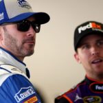 Feb 12, 2016; Daytona Beach, FL, USA; NASCAR Sprint Cup Series driver Jimmie Johnson (48) talks with NASCAR Sprint Cup Series driver Denny Hamlin (11) during practice for the Sprint Unlimited at Daytona International Speedway.