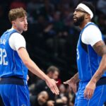 Dallas Mavericks forward Cooper Flagg (32) celebrates with Dallas Mavericks forward Anthony Davis (3) during the first quarter against the Washington Wizards at American Airlines Center.