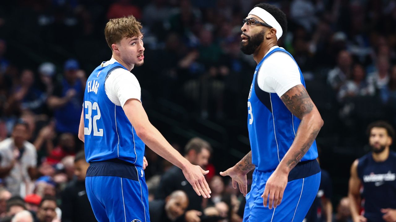 Dallas Mavericks forward Cooper Flagg (32) celebrates with Dallas Mavericks forward Anthony Davis (3) during the first quarter against the Washington Wizards at American Airlines Center.