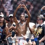 Jun 24, 2025; Oklahoma City, OK, USA; Oklahoma City Thunder guard Shai Gilgeous-Alexander, center, holds up a heart shape with his hands for fans during the Oklahoma City Thunder Champions parade