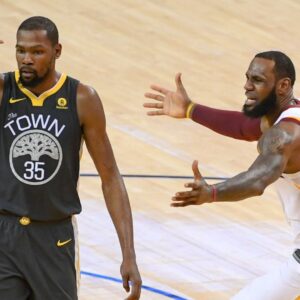 June 3, 2018; Oakland, CA, USA; Golden State Warriors forward Kevin Durant (35) and Cleveland Cavaliers forward LeBron James (23) react during the third quarter in game two of the 2018 NBA Finals at Oracle Arena.
